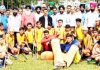 Young players posing for a group photograph along with chief guest and other dignitaries during opening ceremony of inter-district Hockey tournament.