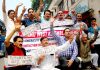 Sunil Dimple, president, Jammu West Assembly Movement along with irate traders during a protest on Monday.