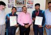 Union Minister Dr Jitendra Singh felicitating Komal and Karan in Jammu on Monday. —Excelsior/Rakesh