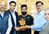 Advisor K Vijay Kumar honouring Asian Games bronze medalist Bhanu Partap Singh Chib in presence of his coach and other dignitaries.