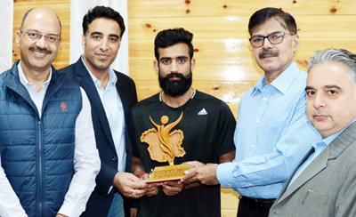 Advisor K Vijay Kumar honouring Asian Games bronze medalist Bhanu Partap Singh Chib in presence of his coach and other dignitaries. Advisor K Vijay Kumar honouring Asian Games bronze medalist Bhanu Partap Singh Chib in presence of his coach and other dignitaries.