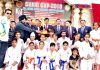 State Karatekas posing for a group photograph after winning medals in SUKAI Cup Karate Championship.
