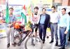 Rohan Philem being flagged off by Chancellor Shardha University PK Gupta for bicycle expedition.