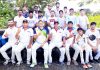 Media XI team players' posing for a group photograph at Phallain Mandal in Jammu.