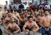 Bodybuilders displaying muscles during weighing of Mr Jammu Bodybuilding C’ship in Jammu.
