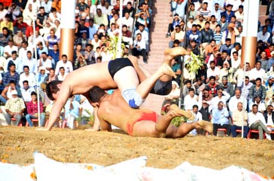 Wrestlers in action during 14th Mission Dosti Dangal event at Katra on Tuesday. Wrestlers in action during 14th Mission Dosti Dangal event at Katra on Tuesday.