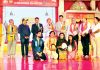 Winners of preliminary round of All India Devotional Song Competition and dignitaries posing for group photograph.