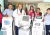 Directors of Wellness Zone Headmaster along with other staff posing with latest laser machines at their first Medi Spa in J&K.