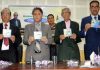 Advisor Khurshid Ahmed Ganai and others releasing musical album of poet Dr Syed Amin Tabish at DIPR auditorium on Saturday.