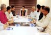 BJP State president, Ravinder Raina chairing a meeting of party office bearers at Trikuta Nagar on Monday.