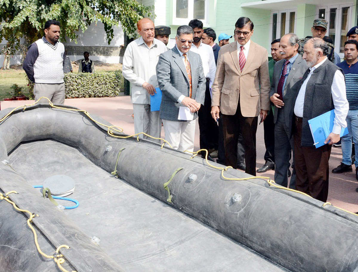 Advisor K Vijay Kumar inspecting a boat during workshop on disaster management. Advisor K Vijay Kumar inspecting a boat during workshop on disaster management.