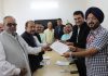 Members of a joint delegation of HRA Katra and PHDCCI Jammu presenting a memorandum of demands to CEO, SMVDSB, Simrandeep Singh.