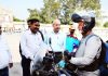 RTO Kathua and his team receiving biker who covered 27000 kms on his two wheeler before reaching Kathua on Friday. -Excelsior/ Pardeep