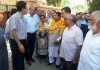 Former Minister & MLA Jammu West, Sat Sharma interacting with officers and people in Talab Tillo area on Friday.