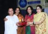 Winner of symposium being awarded by organizers at GCW Gandhi Nagar on Thursday.
