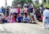 Villagers blocking Bantalab-Gharota road at Kaink Morh in Jammu.