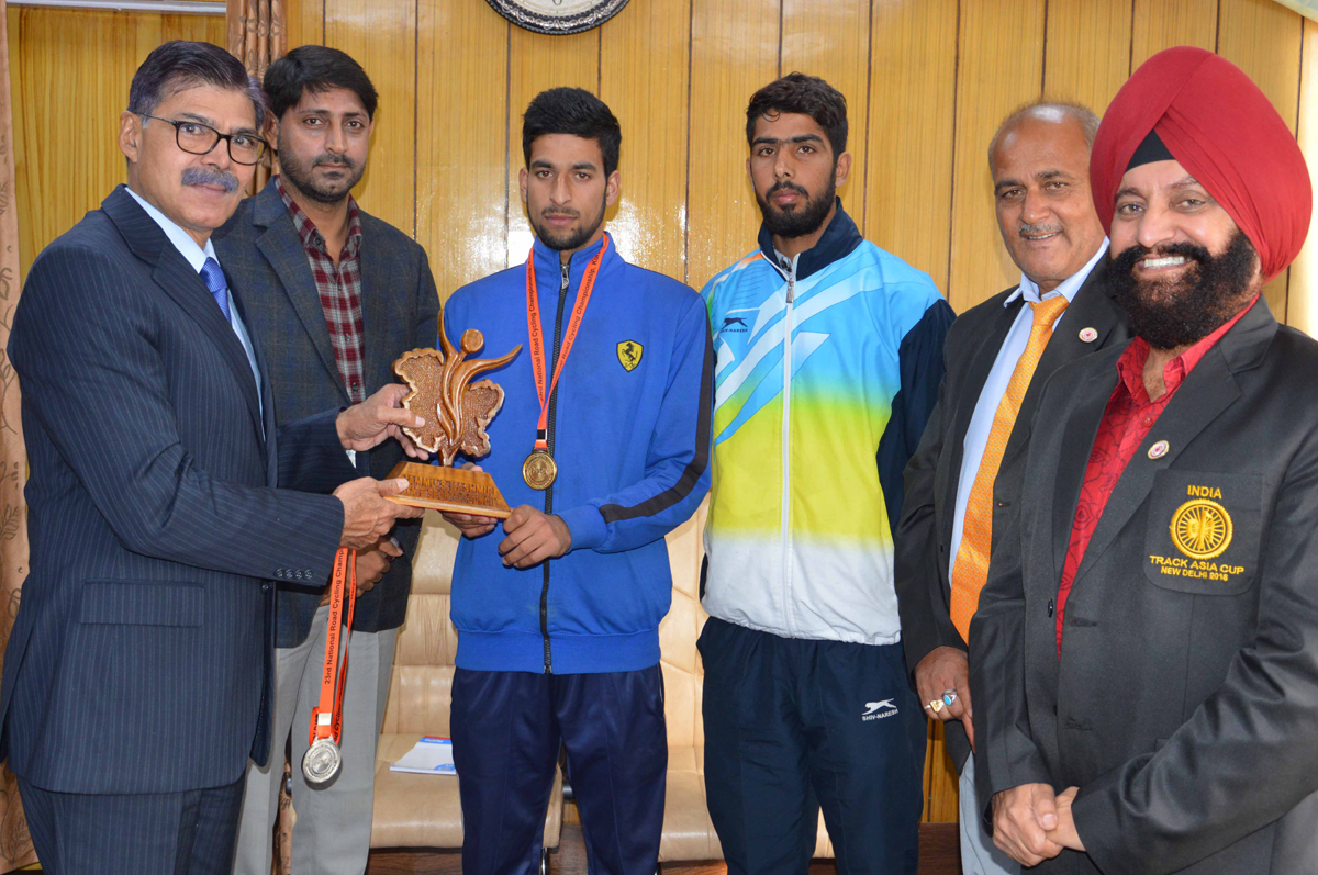 Advisor K Vijay Kumar felicitating cyclists Rameez Raza and Wahid Ahmad. Advisor K Vijay Kumar felicitating cyclists Rameez Raza and Wahid Ahmad.
