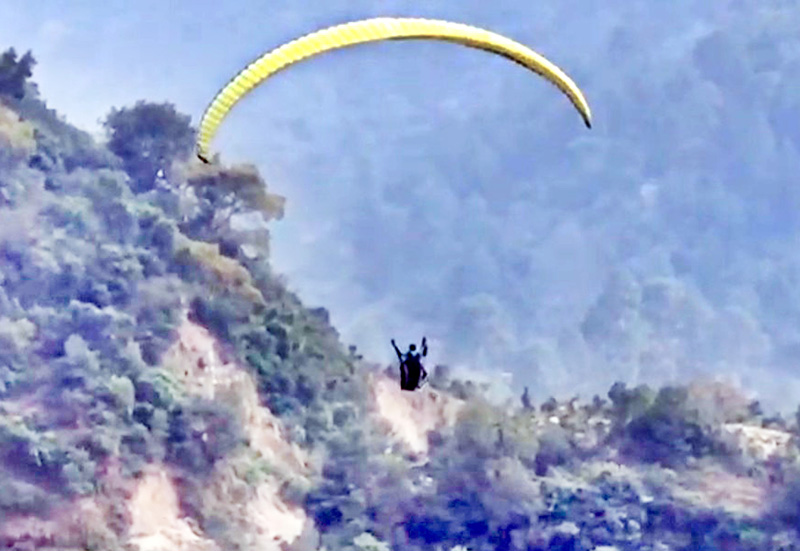 A paragliding trial being conducted near village Tanwa in Reasi district. A paragliding trial being conducted near village Tanwa in Reasi district.