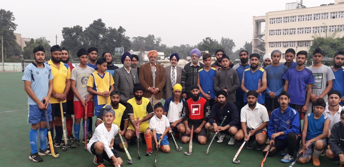 Hockey players and dignitaries posing for group photograph. Hockey players and dignitaries posing for group photograph.
