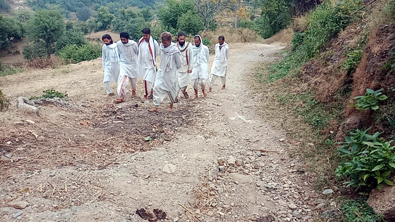 Due to bad condition of road, devotees travelling on foot to reach temple at Kreni village in Reasi. Due to bad condition of road, devotees travelling on foot to reach temple at Kreni village in Reasi.