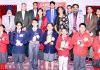 Winners of Sahodaya Inter-School Hindi Debate Competition and dignitaries posing for group photograph.