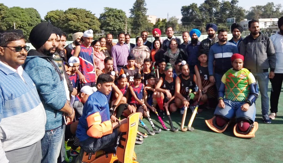 Hockey players and dignitaries posing for group photograph. Hockey players and dignitaries posing for group photograph.