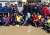 Participants of State Level Inter Division Handball Tournament and dignitaries posing for group photograph.