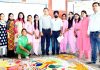 Winners of Rangoli Competition and dignitaries posing for group photograph.
