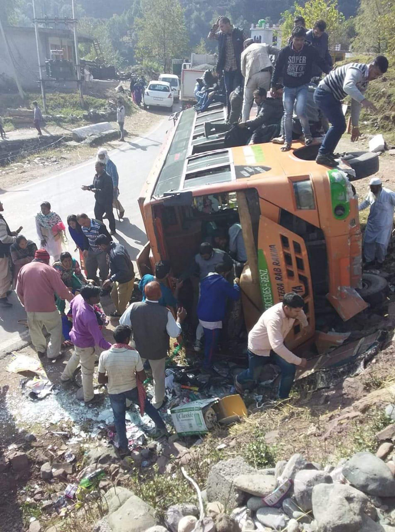 People engaged in rescue work after a bus overturned on the road in Surankote area of Poonch on Friday. -Excelsior/ Harbhajan People engaged in rescue work after a bus overturned on the road in Surankote area of Poonch on Friday. -Excelsior/ Harbhajan