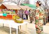 Army officers and jawans paying floral tributes to martyr, Nazir Ahmed Wani at Devsar in Kulgam on Monday. -Excelsior/Sajjad Dar