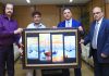 Foot artist, Uttam Kumar Bharadwaj presenting a painting to J&K Bank Chairman, Parvez Ahmed.