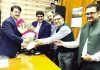 A delegation of industrialists presenting a bouquet to CT Commissioner, PK Bhat.