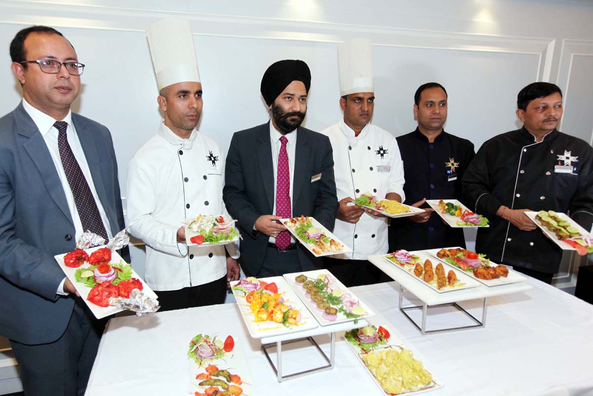 Chefs and officials of KC Residency displaying cuisines on Saturday. -Excelsior/Rakesh Chefs and officials of KC Residency displaying cuisines on Saturday. -Excelsior/Rakesh