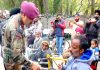 Lt Gen Paramjit Singh, GOC, White Knight Corps, interacting with specially-abled people after distributing mobility equipments among them.