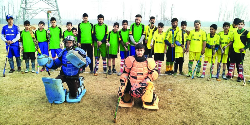 Young hockey players posing for a group photograph in Srinagar on Sunday. Young hockey players posing for a group photograph in Srinagar on Sunday.