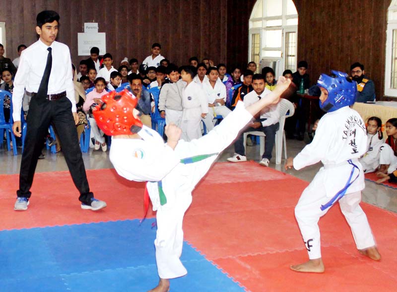 Players in action during a Taekwondo match at Rotary Club, Jammu. Players in action during a Taekwondo match at Rotary Club, Jammu.