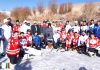 Winners of Ice Hockey exhibition match posing along with dignitaries and officials in Leh on Sunday. -Excelsior/ Morup Stanzin