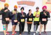 Rajesh Padha and other members of Jammu Runners Group posing with their medals won in ‘Super Sikh Run’ at New Delhi.