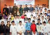 Taekwondo players posing along with chief guest and other dignitaries in Jammu on Sunday.