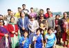 Winners of Inter-District Athletics Meet posing along with chief guest and other dignitaries at Jammu University in Jammu.