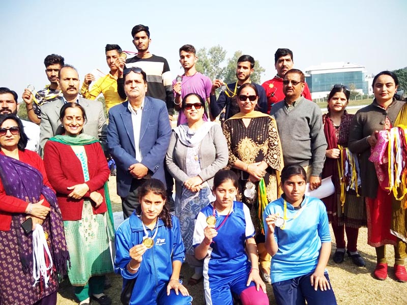 Winners of Inter-District Athletics Meet posing along with chief guest and other dignitaries at Jammu University in Jammu. Winners of Inter-District Athletics Meet posing along with chief guest and other dignitaries at Jammu University in Jammu.