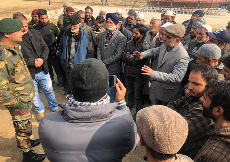 A senior Army officer of 52 RR interacting with apple farmers in Srinagar. A senior Army officer of 52 RR interacting with apple farmers in Srinagar.