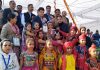Students in colourful attires posing along with dignitaries and officials after presenting cultural item during inaugural ceremony of 64thNational School Games in Jammu.