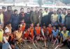 Participating hockey players and dignitaries posing for group photograph.