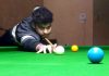 A cueist aiming at target during Six Red Ball match at Billiards Hall, MA Stadium Jammu on Tuesday. — Excelsior/Rakesh
