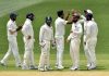 Ravichandran Ashwin celebrates the wicket of Shaun Marsh on day 2 of the first Test against Australia in Adelaide on Friday.