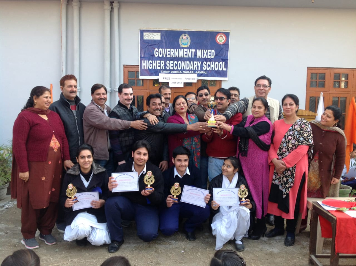 Meritorious students displaying prizes while posing along with Principal Dr Sanjay Pandita and staff members at Mixed HSS Durga Nagar in Jammu. Meritorious students displaying prizes while posing along with Principal Dr Sanjay Pandita and staff members at Mixed HSS Durga Nagar in Jammu.