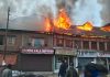 Shops in flames at Pahalgam market. -Excelsior/Sajad Dar