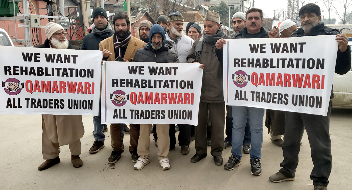 Qamarwari traders protesting at Press Enclave Srinagar. — Excelsior/Shakeel Qamarwari traders protesting at Press Enclave Srinagar. — Excelsior/Shakeel