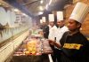Chefs preparing sizzlers during food festival at Pirates of Grill Jammu.